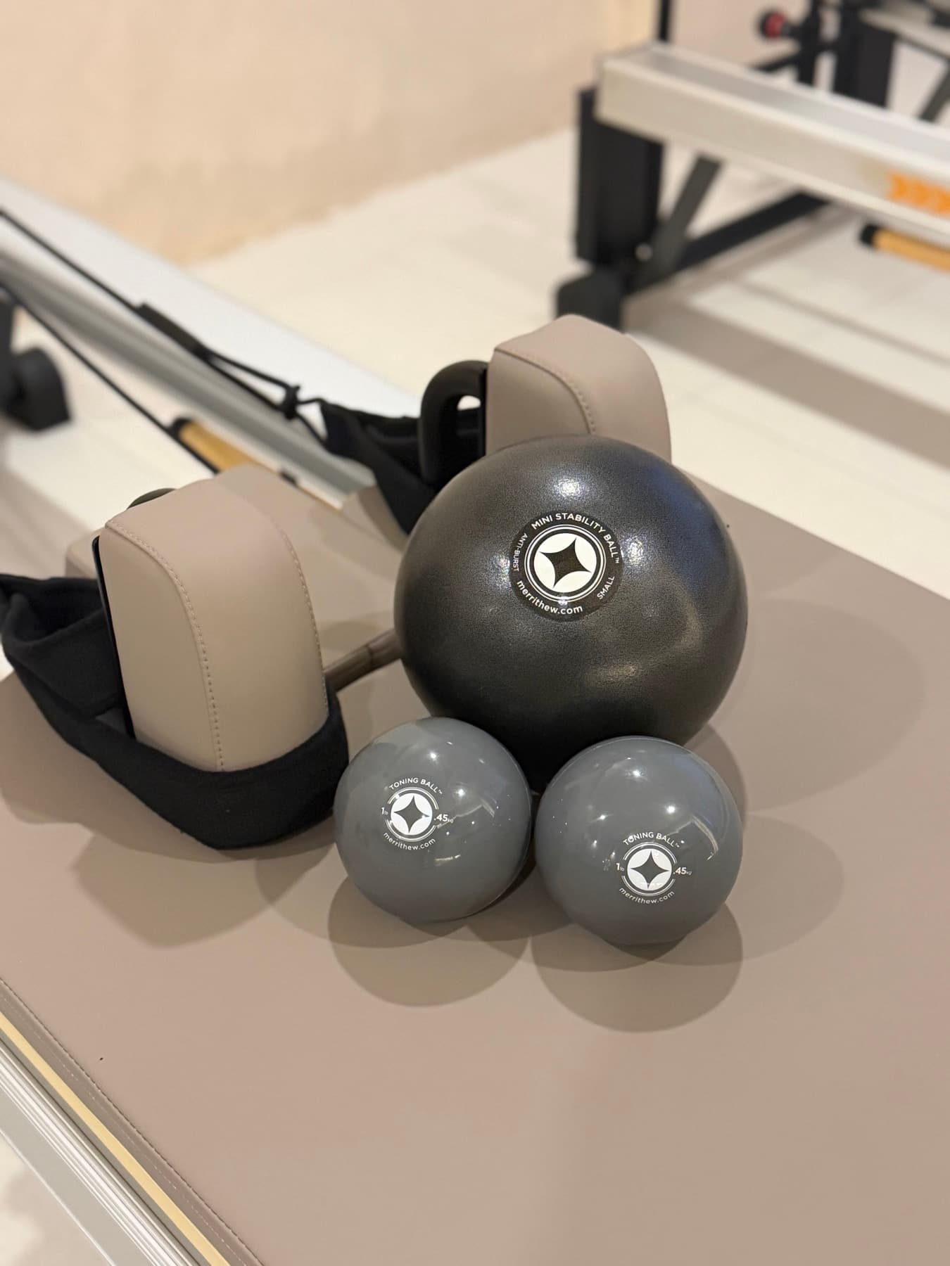 Balls and shoulder blocks set up on a reformer